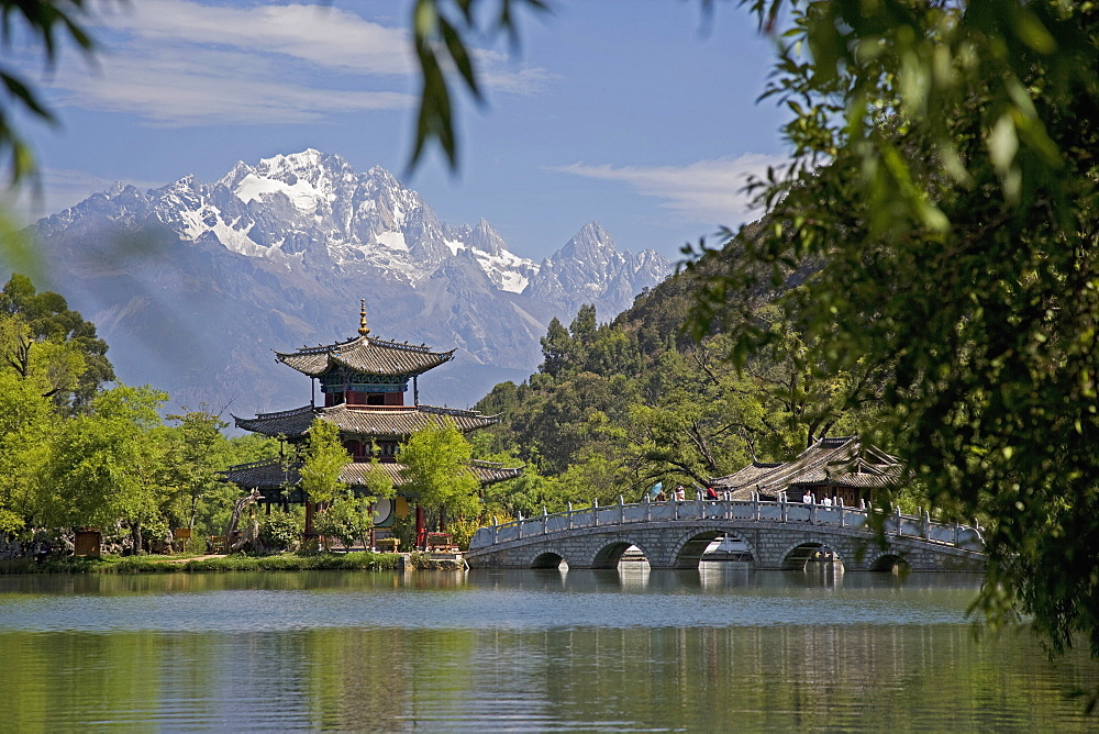 Black Dragon Pool Park, temple and bridge, with Jade Dragon Snow Mountain in background, Lijiang, Yunnan Province, China, Asia 