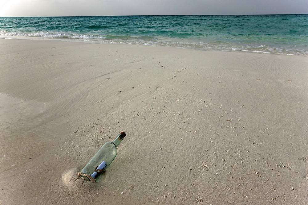 Message in a bottle on a tropical beach, Kuramathi Island, Ari Atoll, Maldives, Indian Ocean, Asia