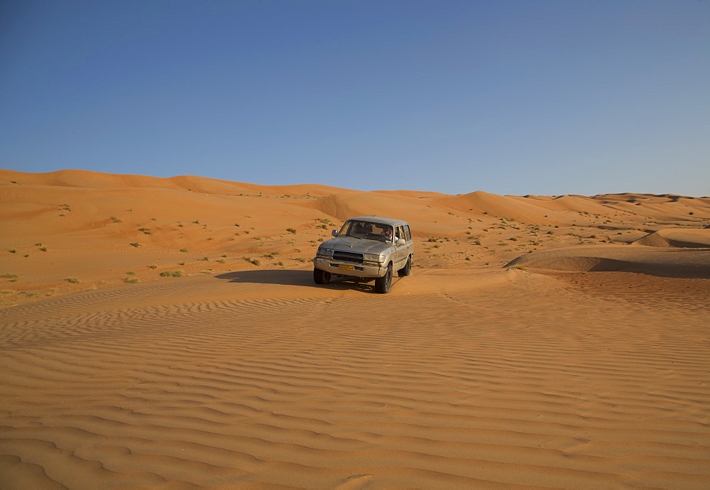 Four wheel drive on desert dunes, Wahiba, Oman, Middle East