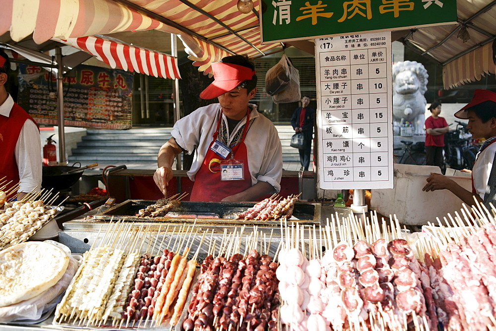 Food vendor in Wangfujing Snak Road, Wangfujing Dajie Shopping district, Beijing (Peking), China, Asia