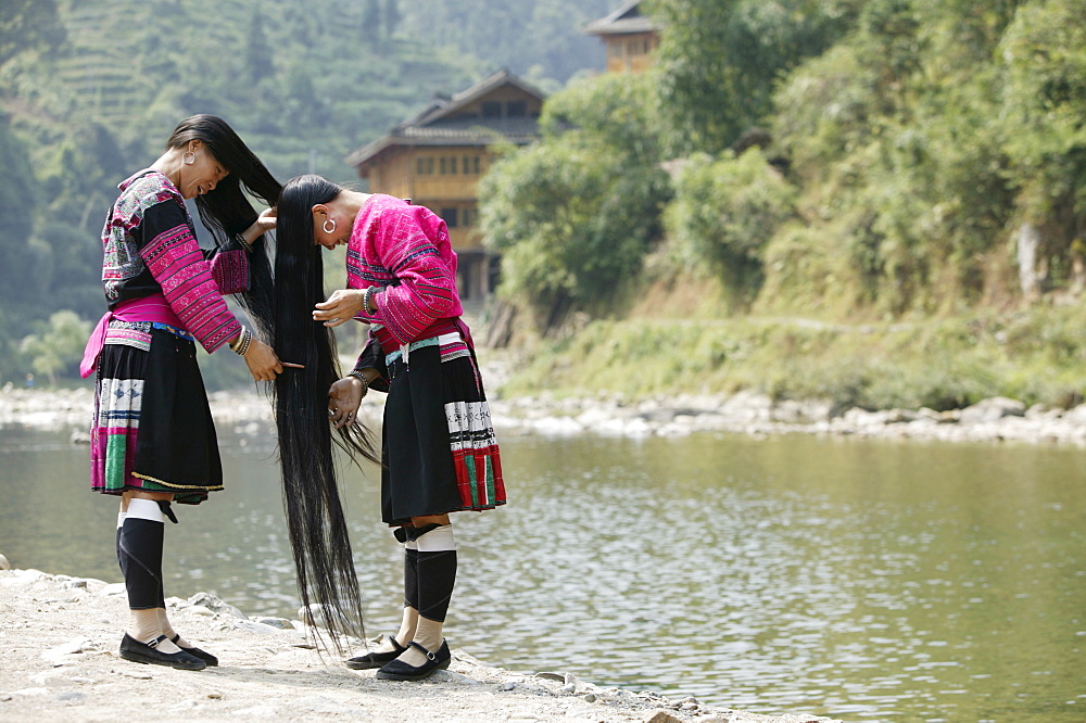 Young women of Yao Minority (Long hair) tribe, Huanglo Yao village, Longsheng terraced ricefields, Guangxi Province, Guilin, China, Asia