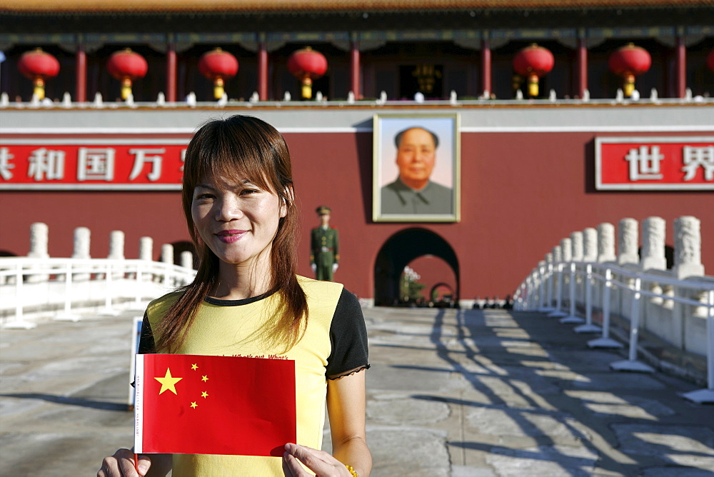 Chinese woman with flag, the Heavenly Gate to the Forbidden City, Tiananmen Square, Beijing, China, Asia