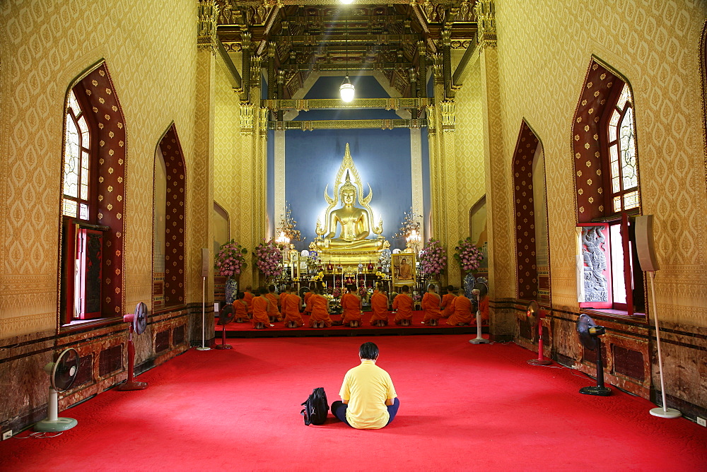 Man and monks praying, Wat Benchamabophit (Marble Temple), Bangkok, Thailand, Southeast Asia, Asia