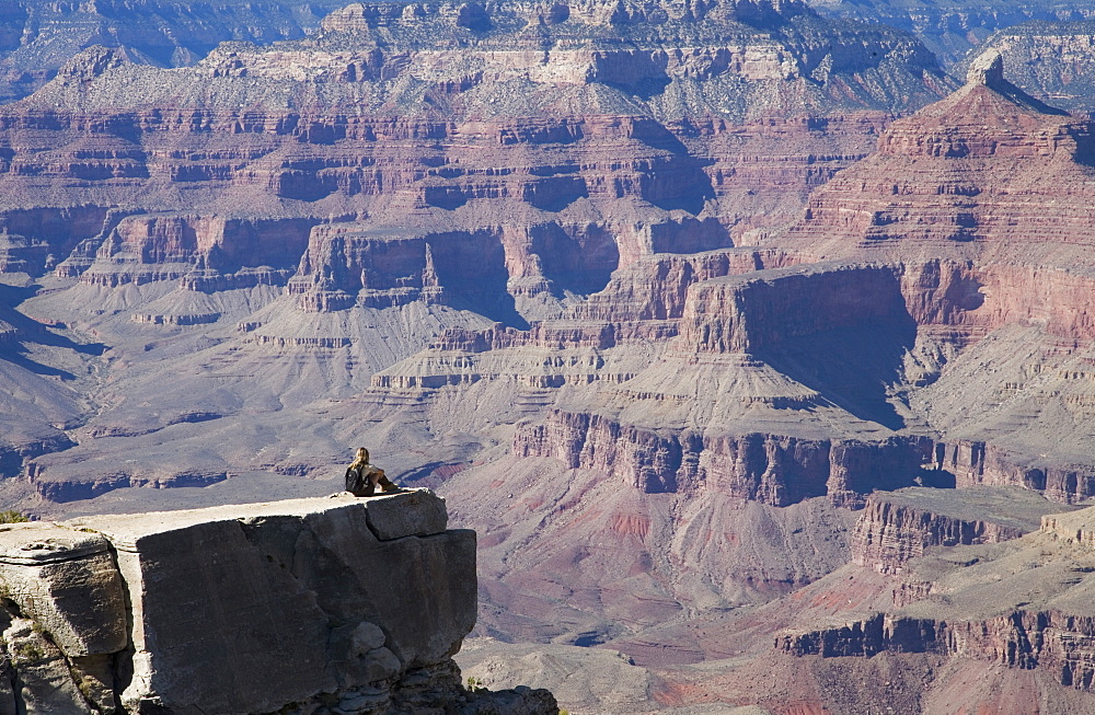 Woman looking over the Grand Canyon, Grand Canyon National Park, UNESCO World Heritage Site, Arizona, United States of America, North America