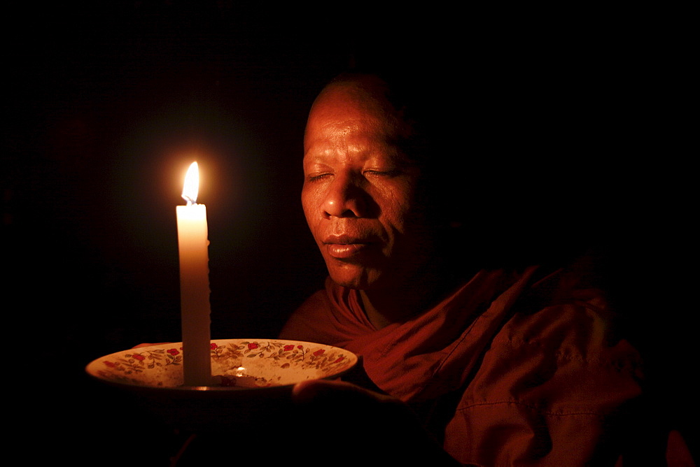 A monk meditates at a Buddhist temple in Sen Monorom, Mondulkiri province, Cambodia, Indochina, Southeast Asia, Asia