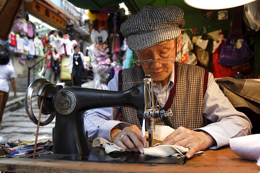 A tailor at work in Hong Kong, China, Asia