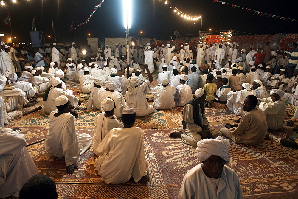 Celebrating the Prophet's birthday, a sheikh preaches to members of his tariqa (sufi order), Shendi, Sudan, Africa