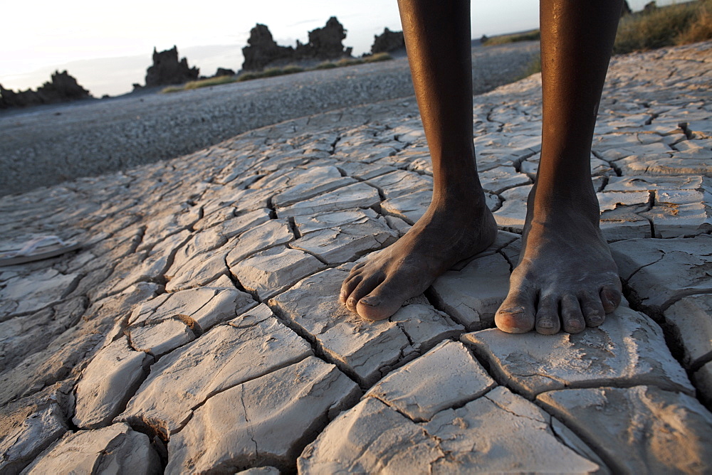 Standing in the desolate landscape of Lac Abbe, Djibouti, Africa