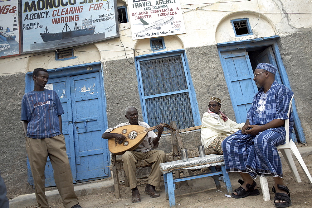 Locals relax with some traditional music, on the streets of Berbera, Somaliland, Somalia, Africa