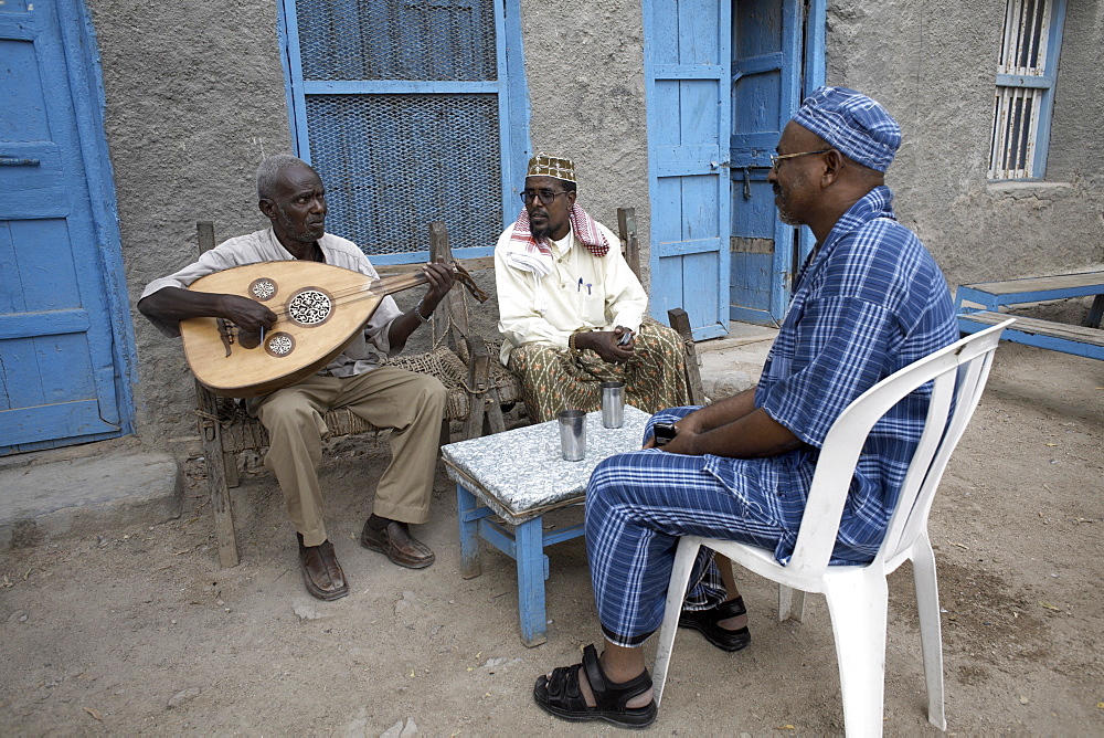 Locals relax with some traditional music, on the streets of Berbera, Somaliland, Somalia, Africa