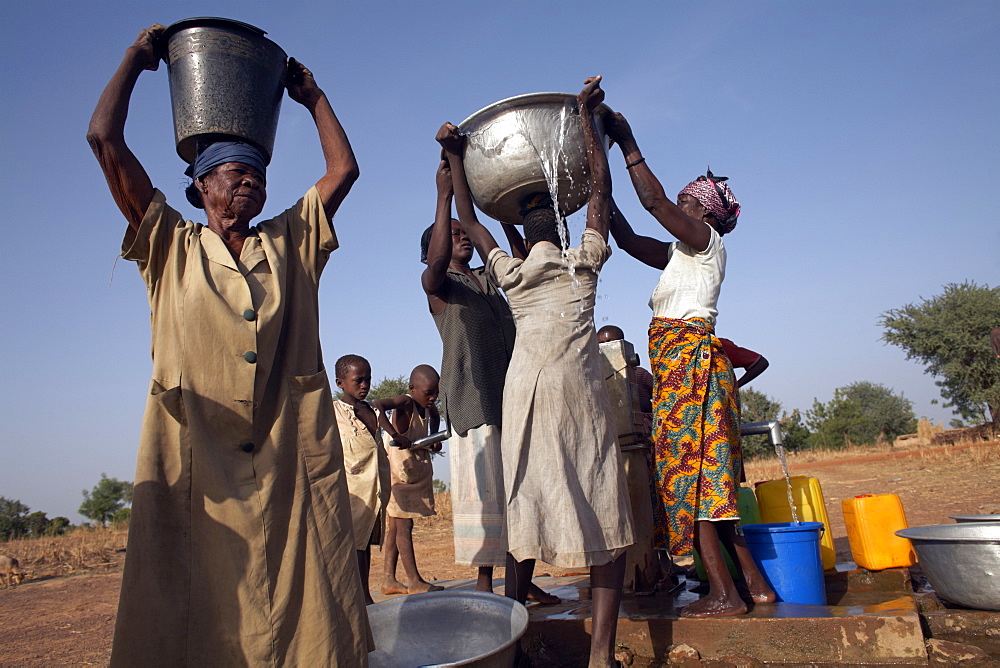 Villagers collect water near Nandom, Ghana, West Africa, Africa