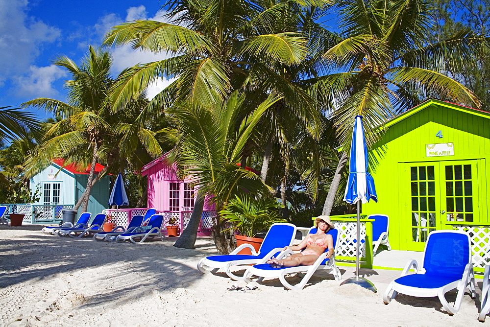 Beach cabana and woman, Princess Cays, Eleuthera Island, Bahamas, West Indies, Central America