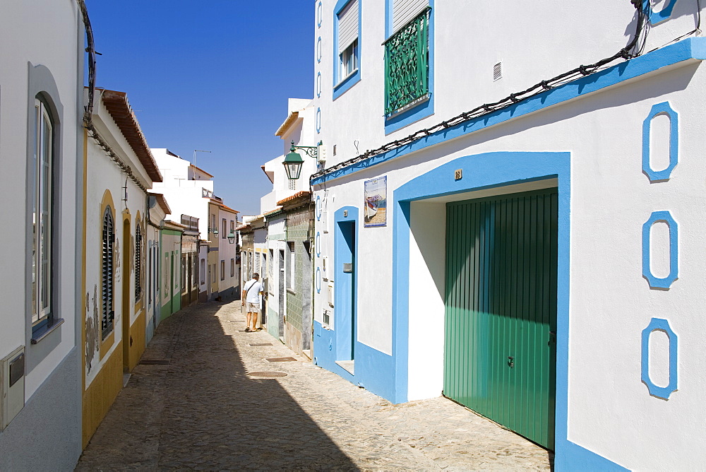 Narrow street in Ferragudo fishing village, Portimao City, Algarve, Portugal, Europe