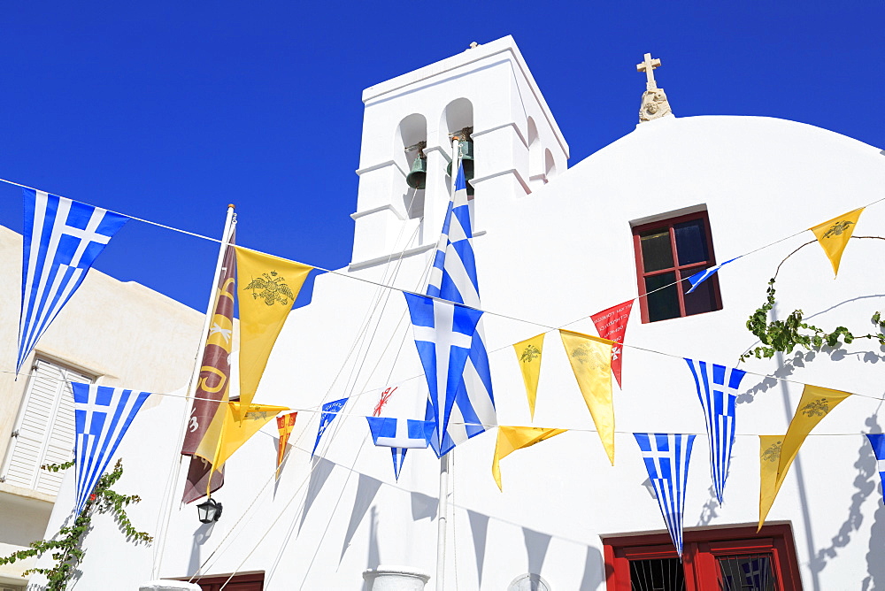 Church with flags in Mykonos Town, Mykonos Island, Cyclades, Greek Islands, Greece, Europe