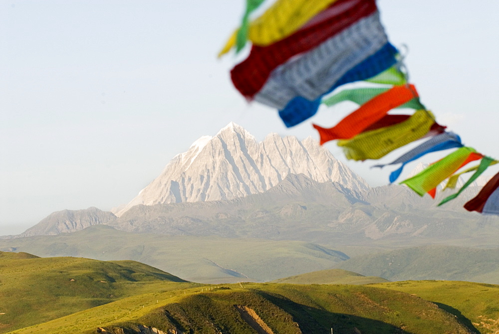 Prayer flags blowing in wind, Snow Mountain, Tagong, Sichuan, China, Asia