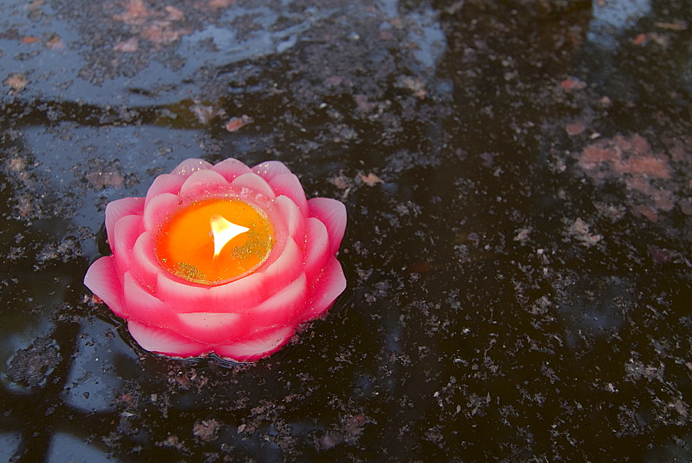 Candle floating in Dafo temple, Leshan, Sichuan, China, Asia