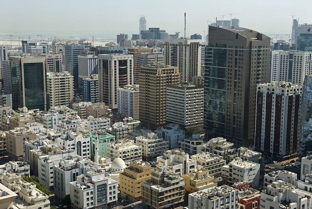 High viewpoint, from the restaurant at the top of Le Royal Meridien Hotel, of city with a mosque contrasting with newer buildings, Abu Dhabi, United Arab Emirates, Middle East