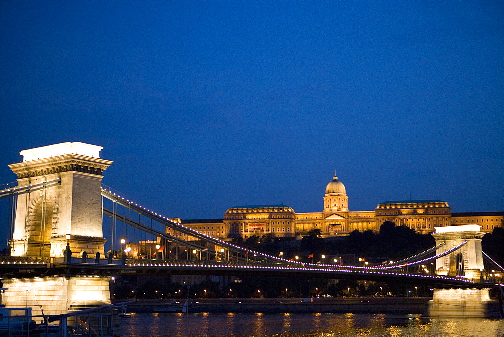 Chain Bridge over Danube with Royal Palace beyond in the evening, Budapest, Hungary, Europe