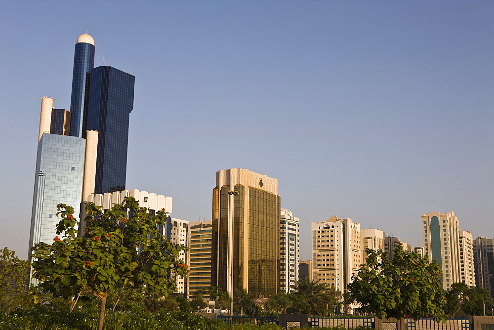 Skyline of modern buildings on the Corniche (waterfront) at Abu Dhabi, United Arab Emirates, Middle East