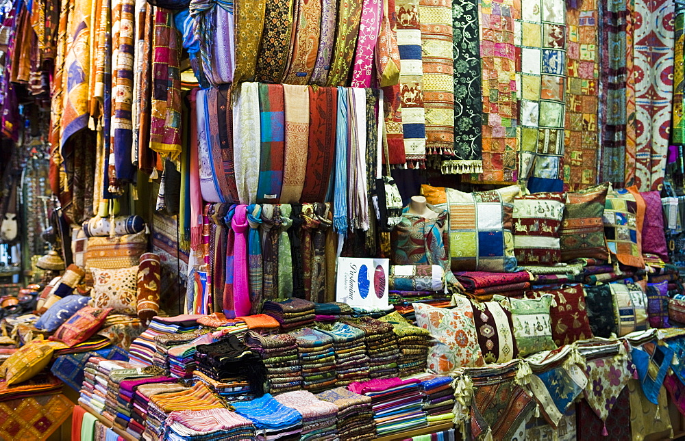 Fabrics, rugs, scarves, cushions for sale, Grand Bazaar (Great Bazaar), Istanbul, Turkey, Europe