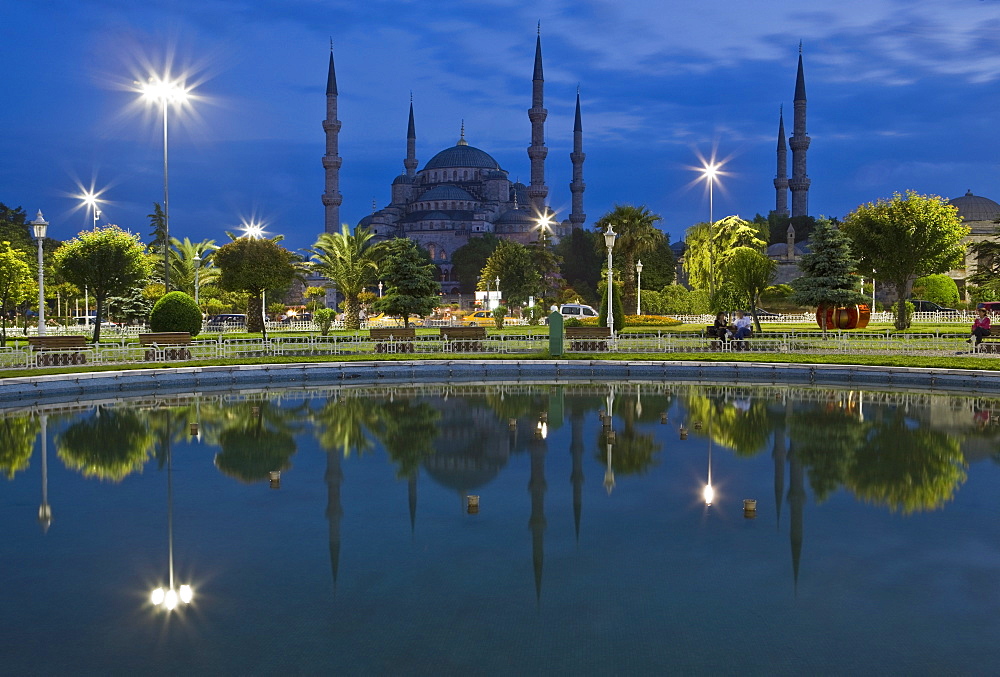 Blue Mosque in evening, reflected in pond, Sultanahmet Square, Istanbul, Turkey, Europe