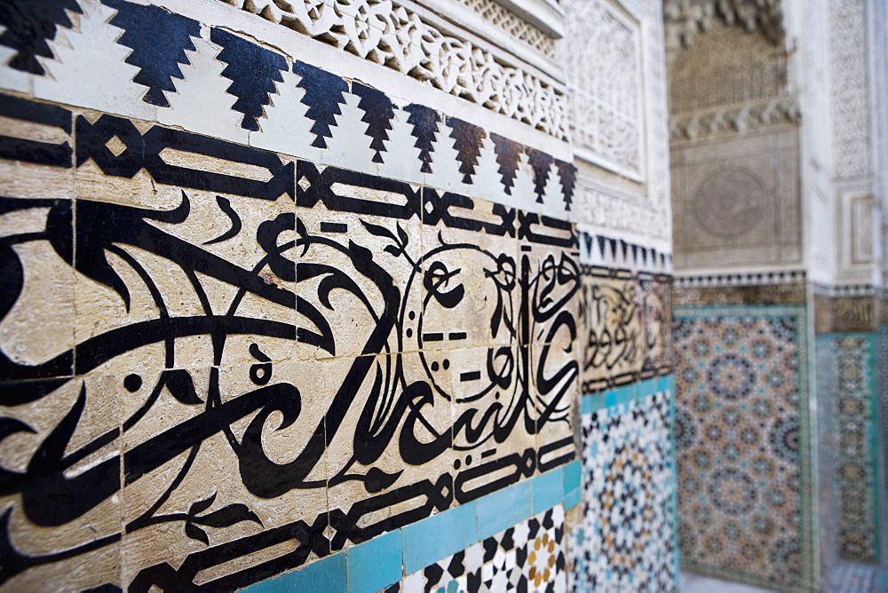 Arabic calligraphy and Zellij tilework, Bou Inania Medersa, Meknes, Morocco, North Africa, Africa