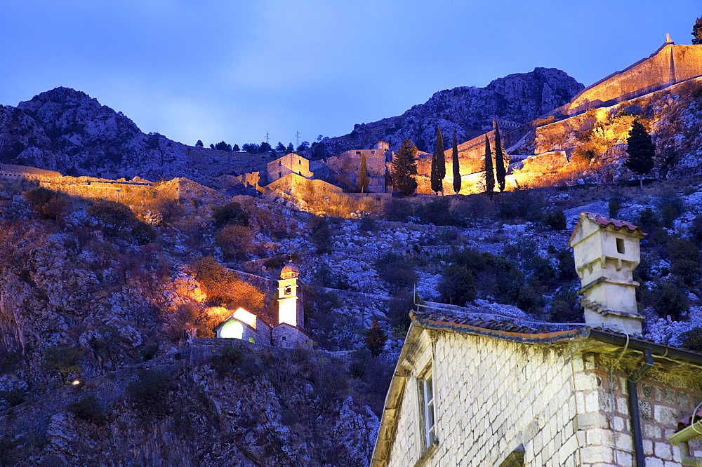 The ramparts of Kotor Castle illuminated at night, Kotor, UNESCO World Heritage Site, Montenegro, Europe