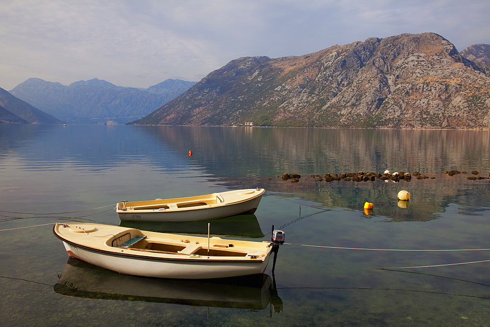 Boats moored in the fjord at Kotor Bay, Kotor, UNESCO World Heritage Site, Montenegro, Europe