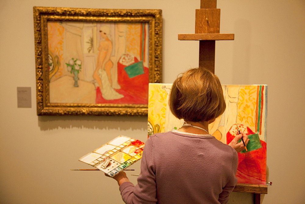 Lady copying a painting in the Orangerie Gallery, Paris, France, Europe