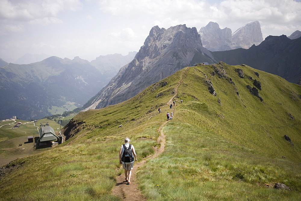 Walkers on footpath, Marmolada mountain, Dolomites, Italy, Europe