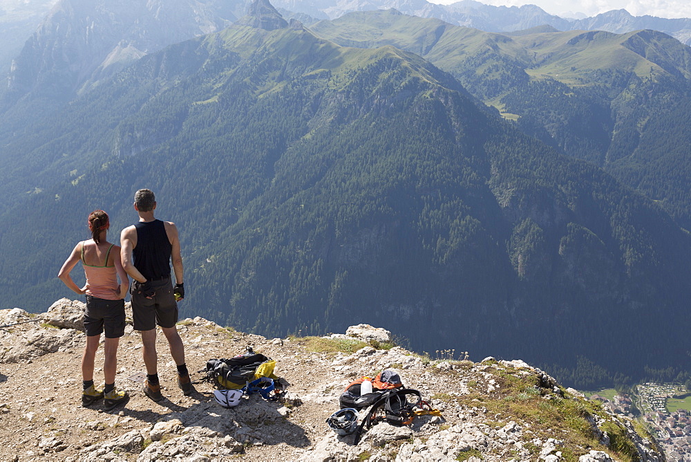 Climbers on the Sassolungo mountains in the Dolomites near Canazei, Italy, Europe