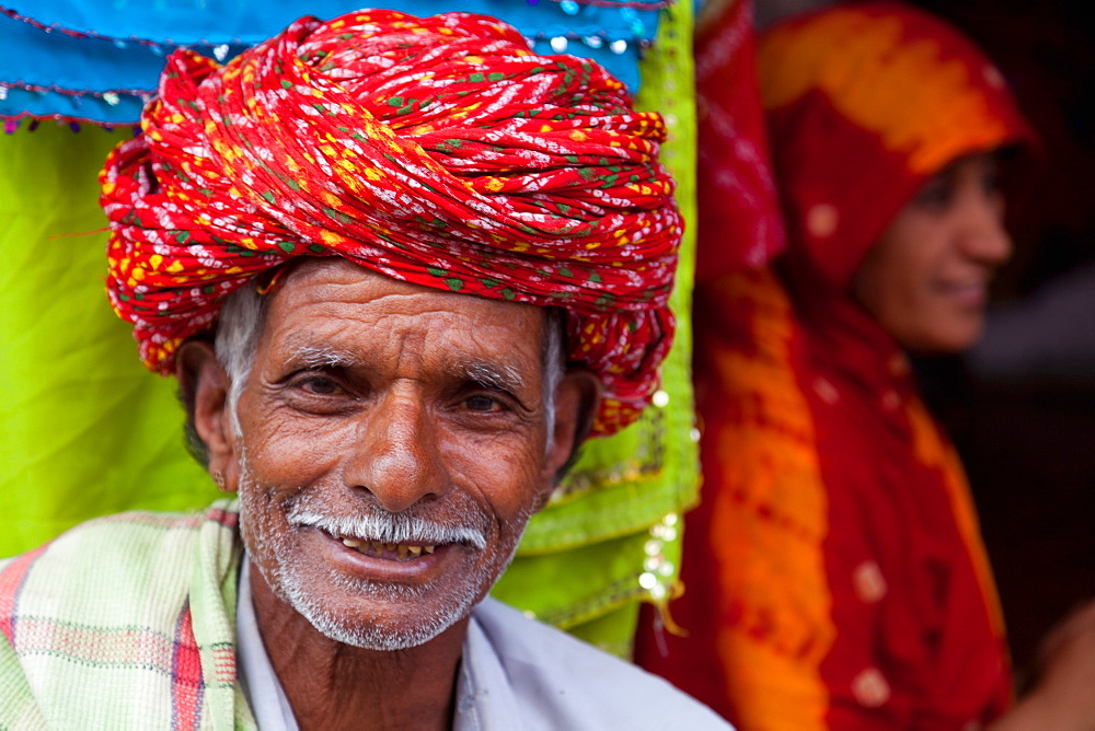 Old man in traditional turban outside a shop in Deogarh, Rajasthan, India, Asia