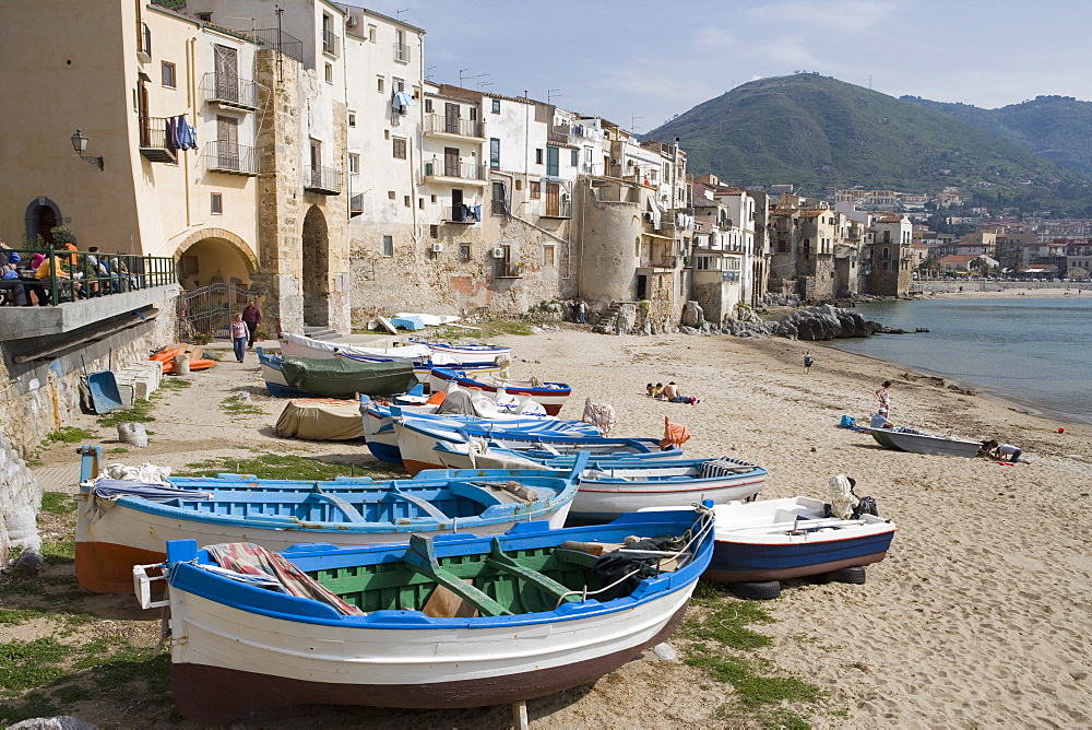 Traditional fishing boats and fishermens houses, Cefalu, Sicily, Italy, Europe