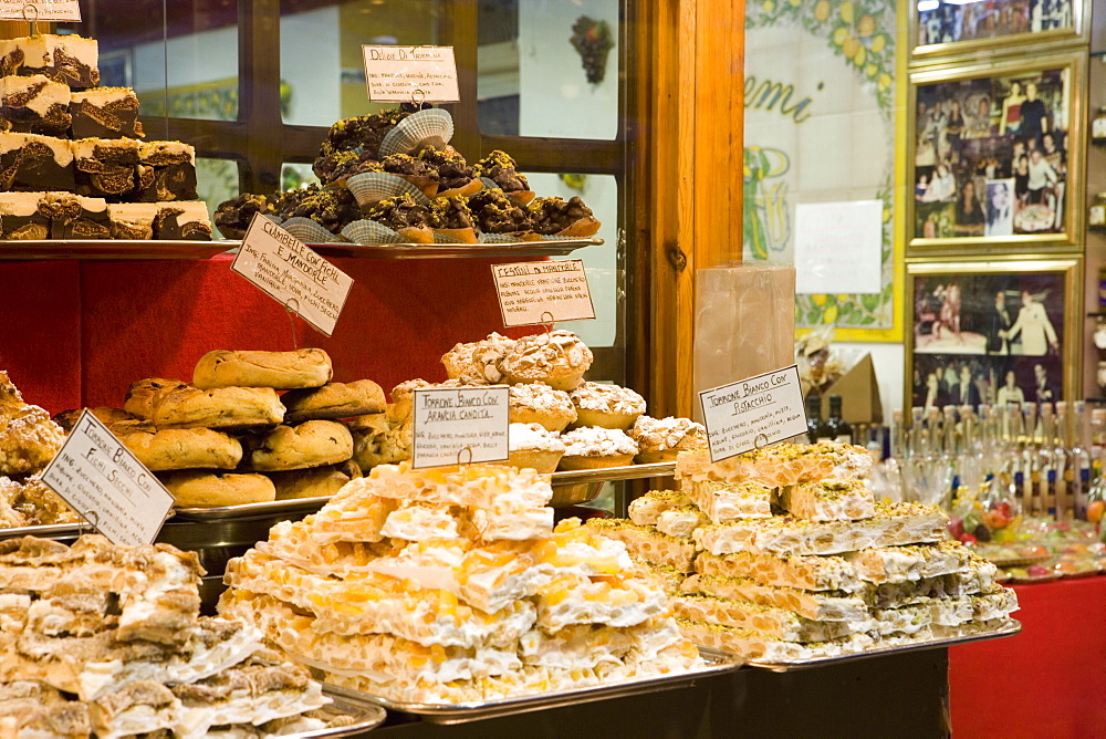 Window display of traditional Torrone, cakes and pastries, Taormina, Sicily, Italy, Europe