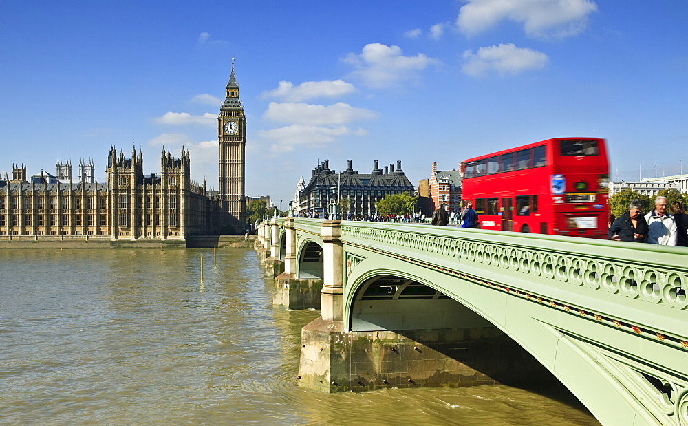 Red London bus crossing Westiminster Bridge, London, England, United Kingdom, Europe