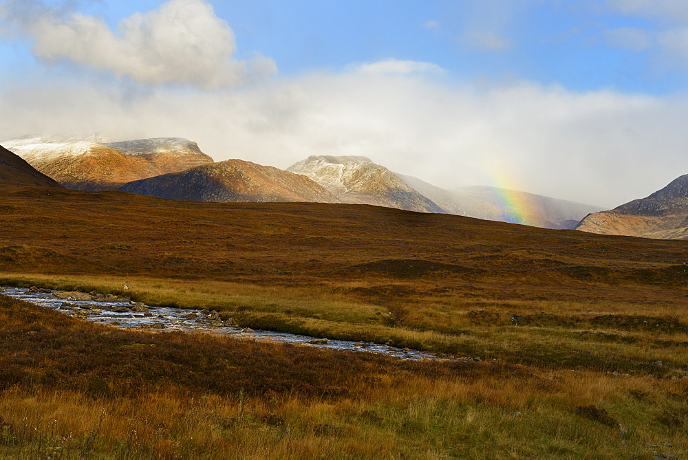 Rainbow over snow capped mountains, Highlands, Scotland, United Kingdom, Europe 