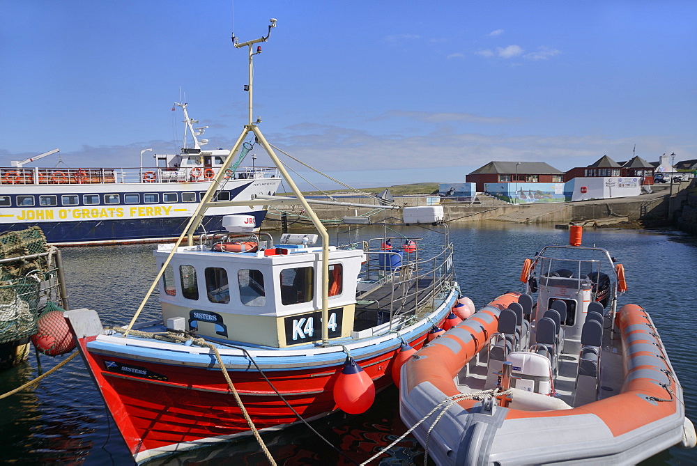 Fishing boat and rigid-inflatable boat in the harbour, John O'Groats, Caithness, Highland Region, Scotland, United Kingdom, Europe