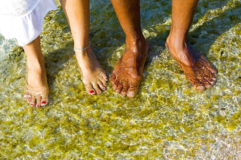 Feet in sea water, Menorca, Balearic Islands, Spain, Europe