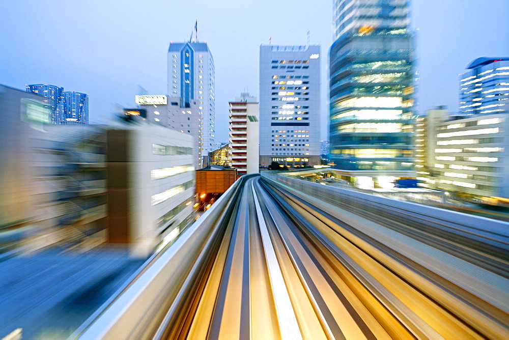 POV blurred motion of Tokyo buildings from a moving train, Tokyo, Honshu, Japan, Asia