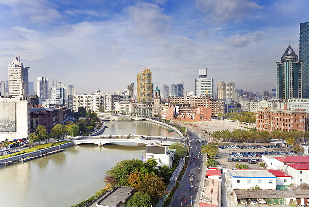 Elevated view along Suzhou Creek, new bridges and city skyline, Shanghai, China, Asia