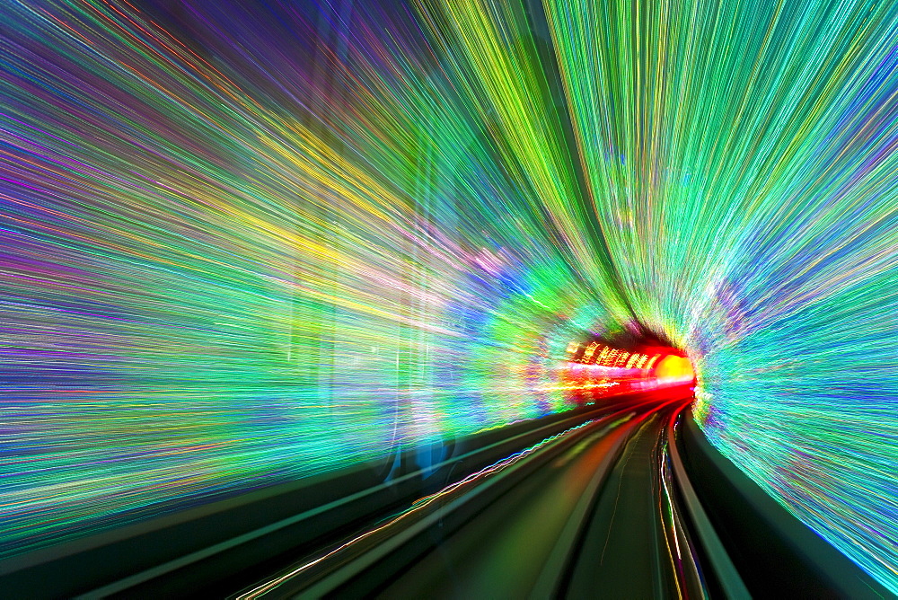 Blurred motion light trails in a train tunnel under the Huangpu River linking the Bund to Pudong, Shanghai, China, Asia