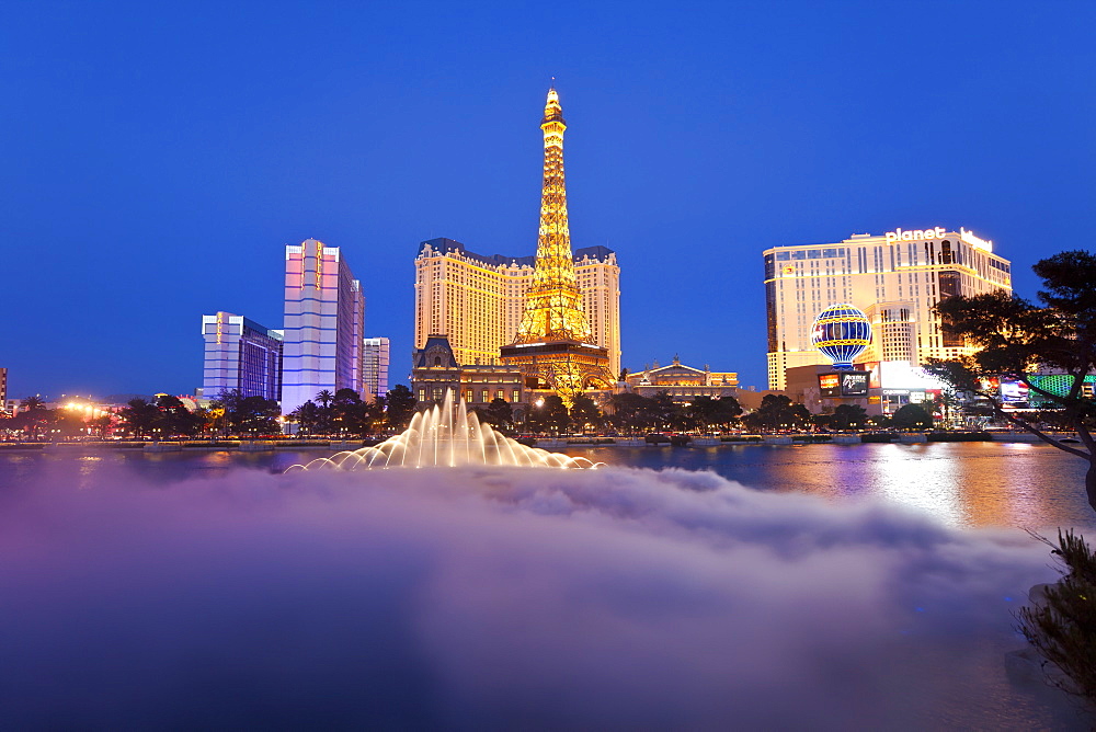 Bellagio fountains perform in front of the Eiffel Tower replica, Las Vegas, Nevada, United States of America, North America