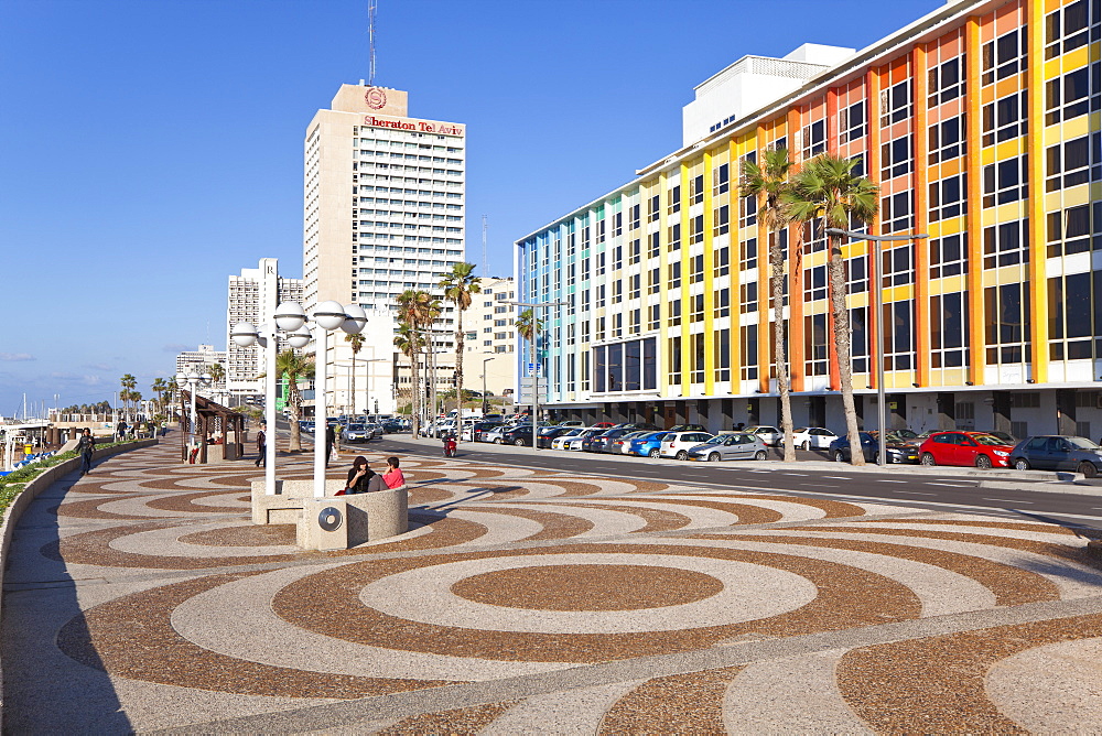 Beachfront promenade in front of the colourfully decorated hotel facades, Tel Aviv, Israel, Middle East