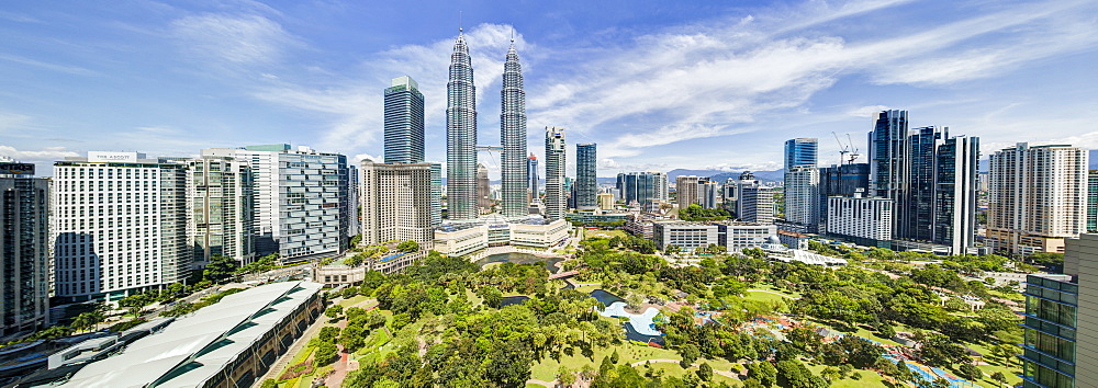 City centre including the KLCC park convention and shopping centre and the iconic 88 storey steel clad Petronas Towers, Kuala Lumpur, Malaysia, Southeast Asia, Asia