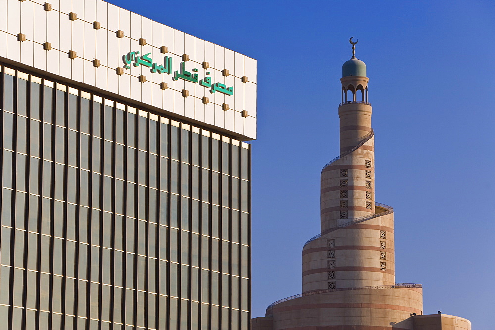 Qatar Central Bank and the spiral mosque of the Kassem Darwish Fakhroo Islamic Centre in Doha based on the Great Mosque in Samarra in Iraq, Doha, Qatar, Middle East