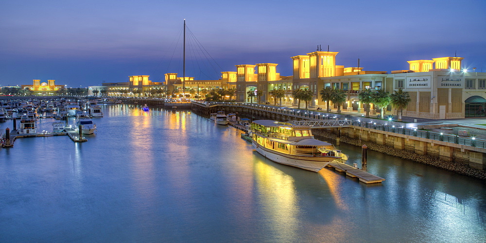 Souk Shark Mall and Kuwait harbour, illuminated at dusk, Kuwait City, Kuwait, Middle East