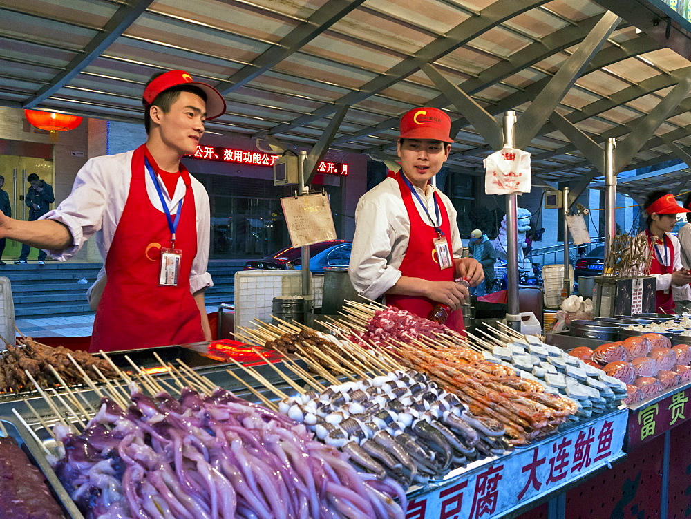 Food stalls at Donganmen night food market near Wangfuging Dajie, Beijing, China, Asia