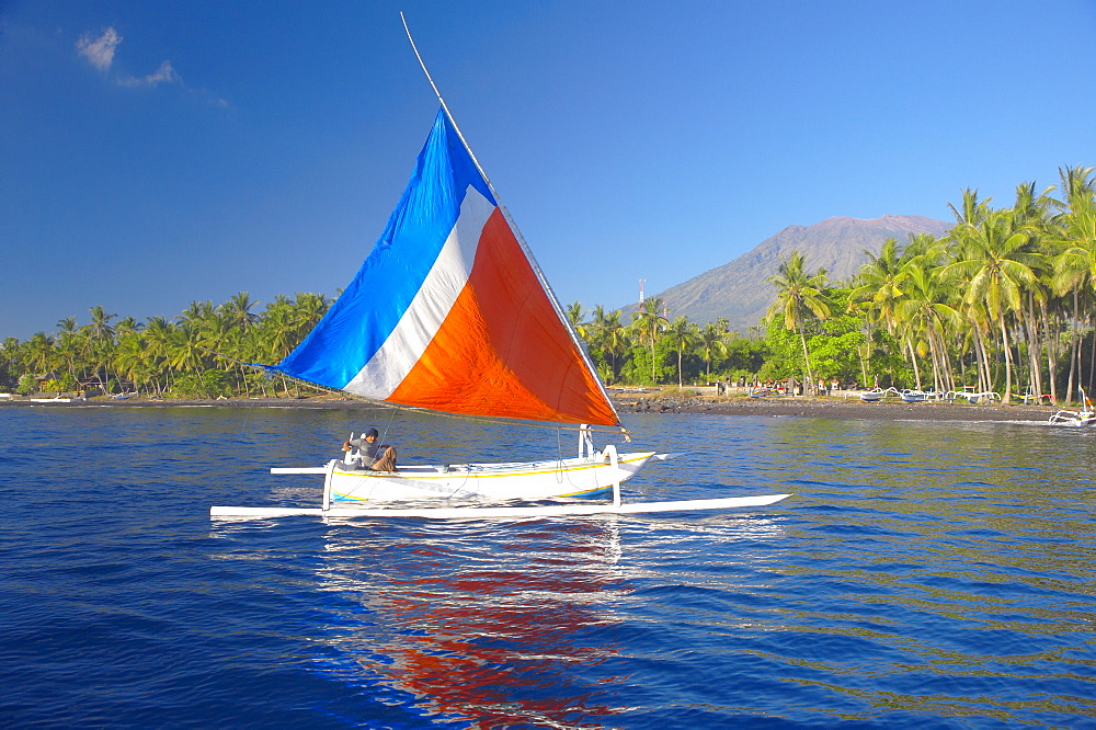 Local fisherman on a traditional outrigger boat, Bali, Indonesia, Southeast Asia, Asia