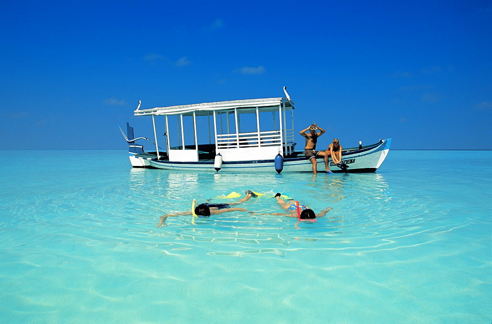 Two couples snorkelling in the Maldives, Indian Ocean, Asia