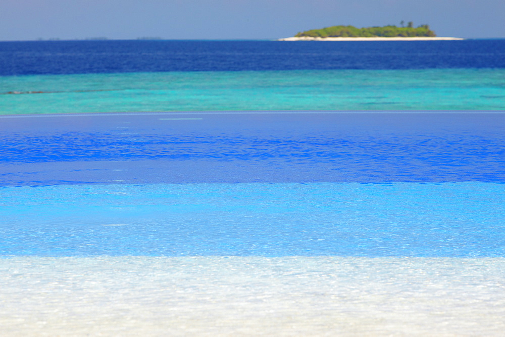 Swimming pool and tropical island, Maldives, Indian Ocean, Asia